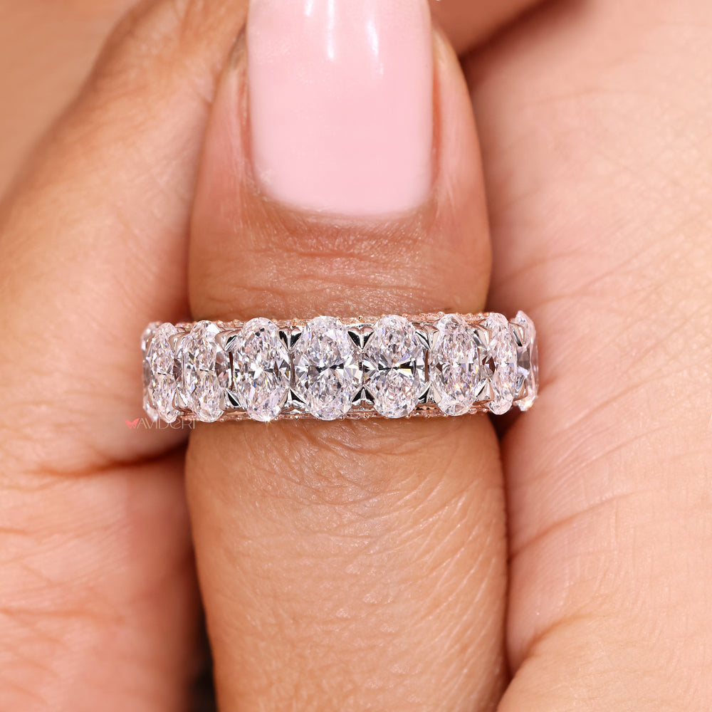 Oval cut band with three row pave diamonds.
