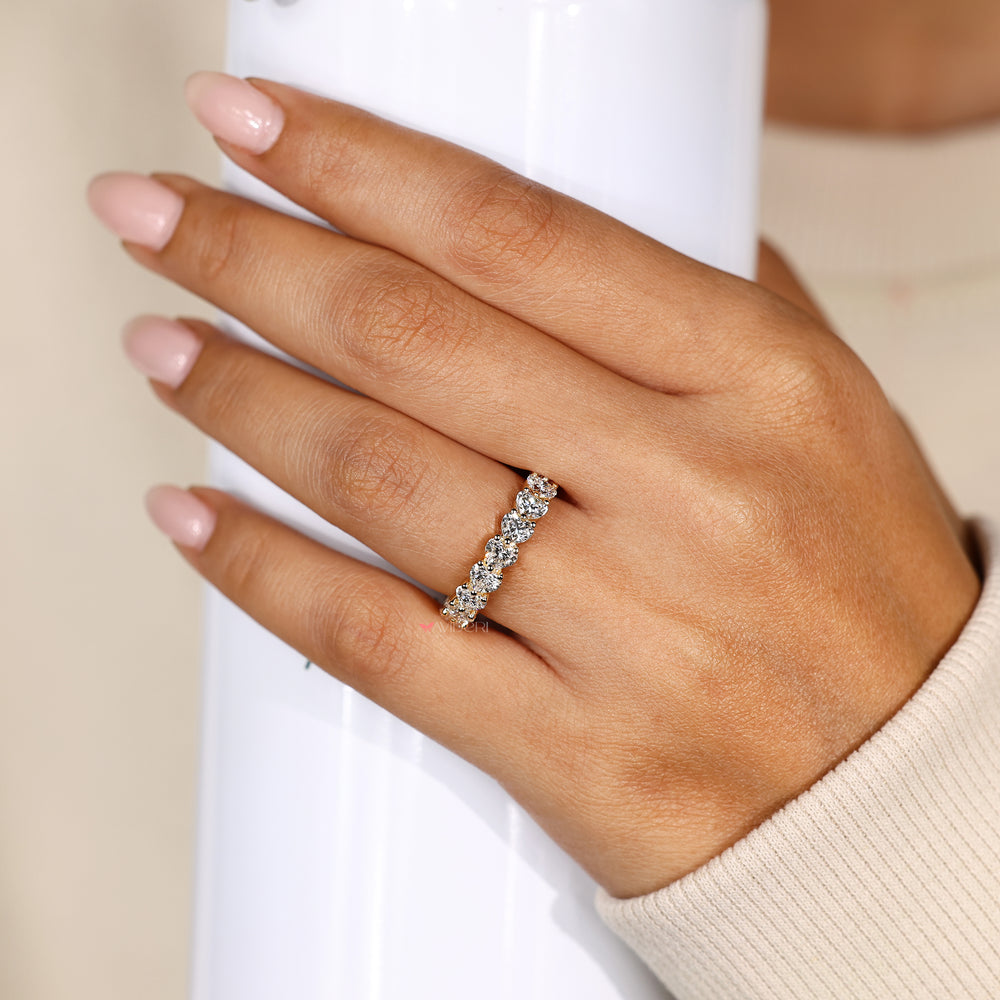 Heart diamond eternity band with shared prongs.
