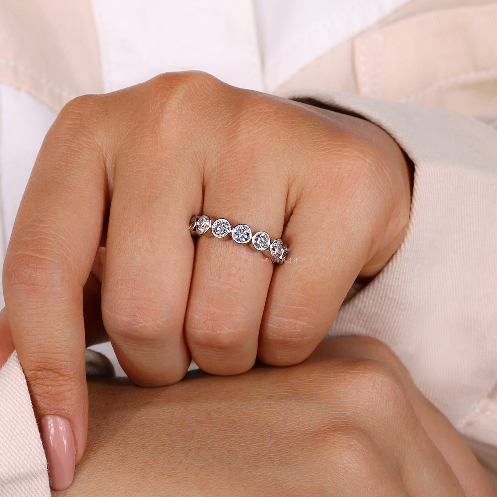 Handmade jewelry piece with lab grown diamonds in a bezel setting.
