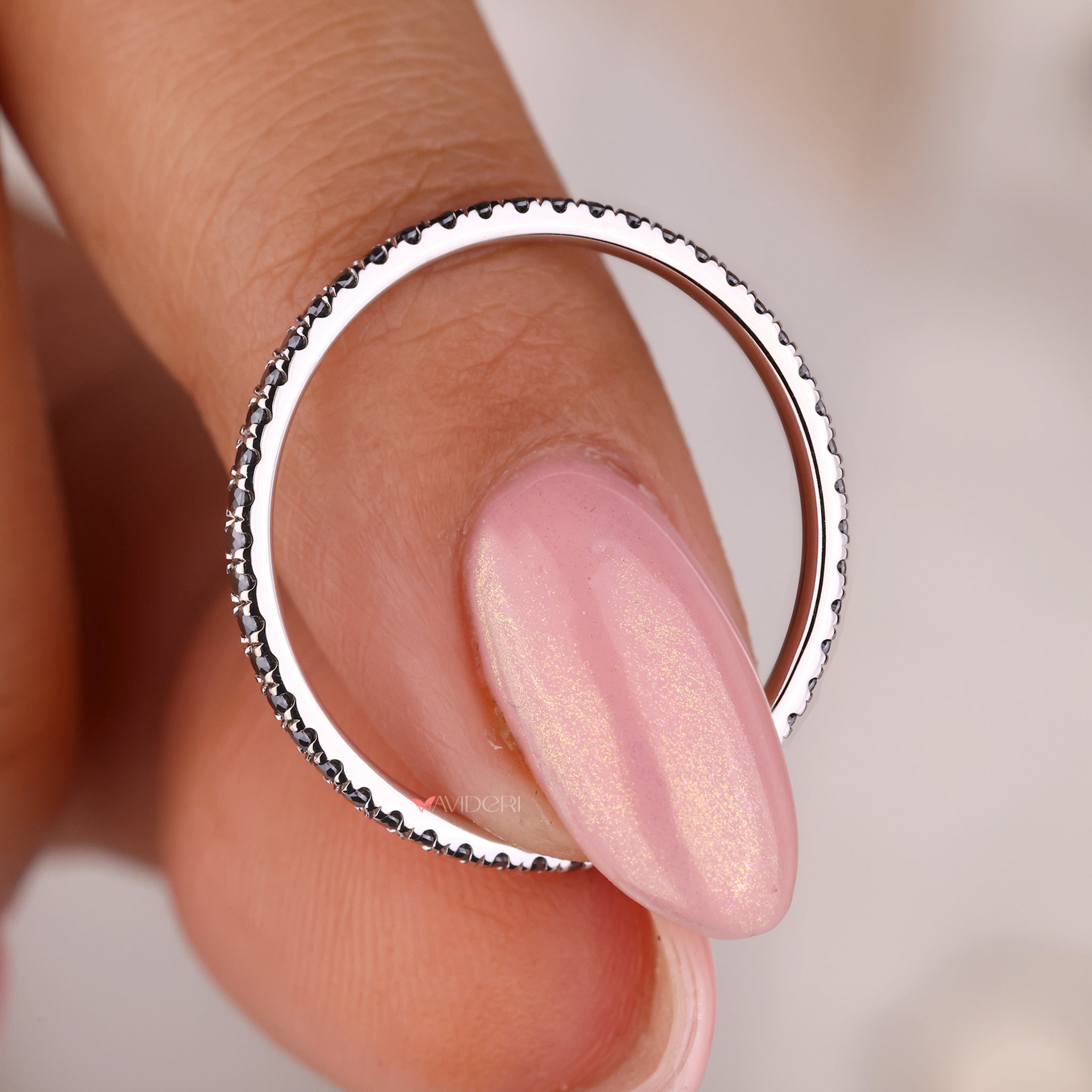 Eternity band ring featuring a round eternity band for brilliance.