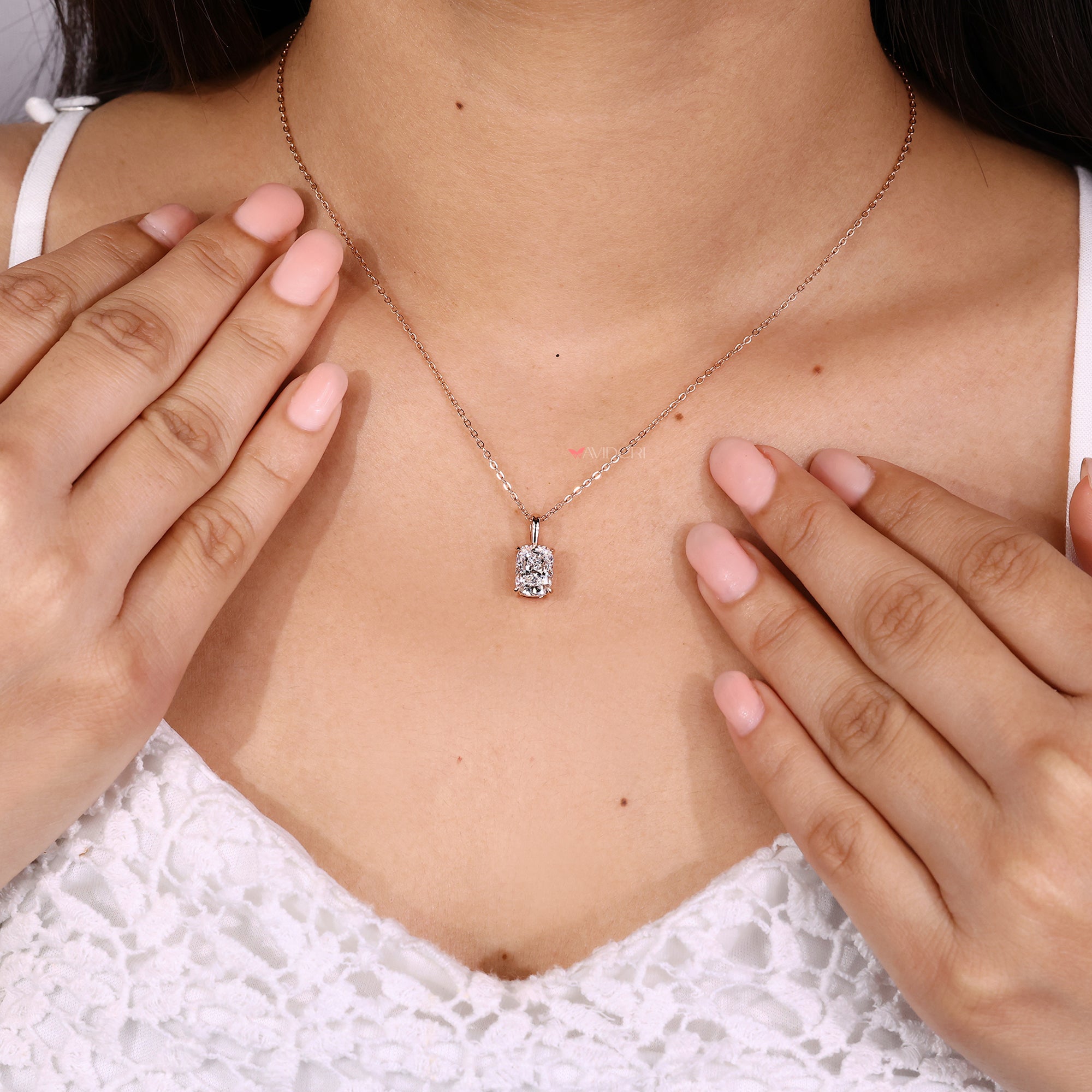 Fancy pendants showcasing cushion cut diamond settings.