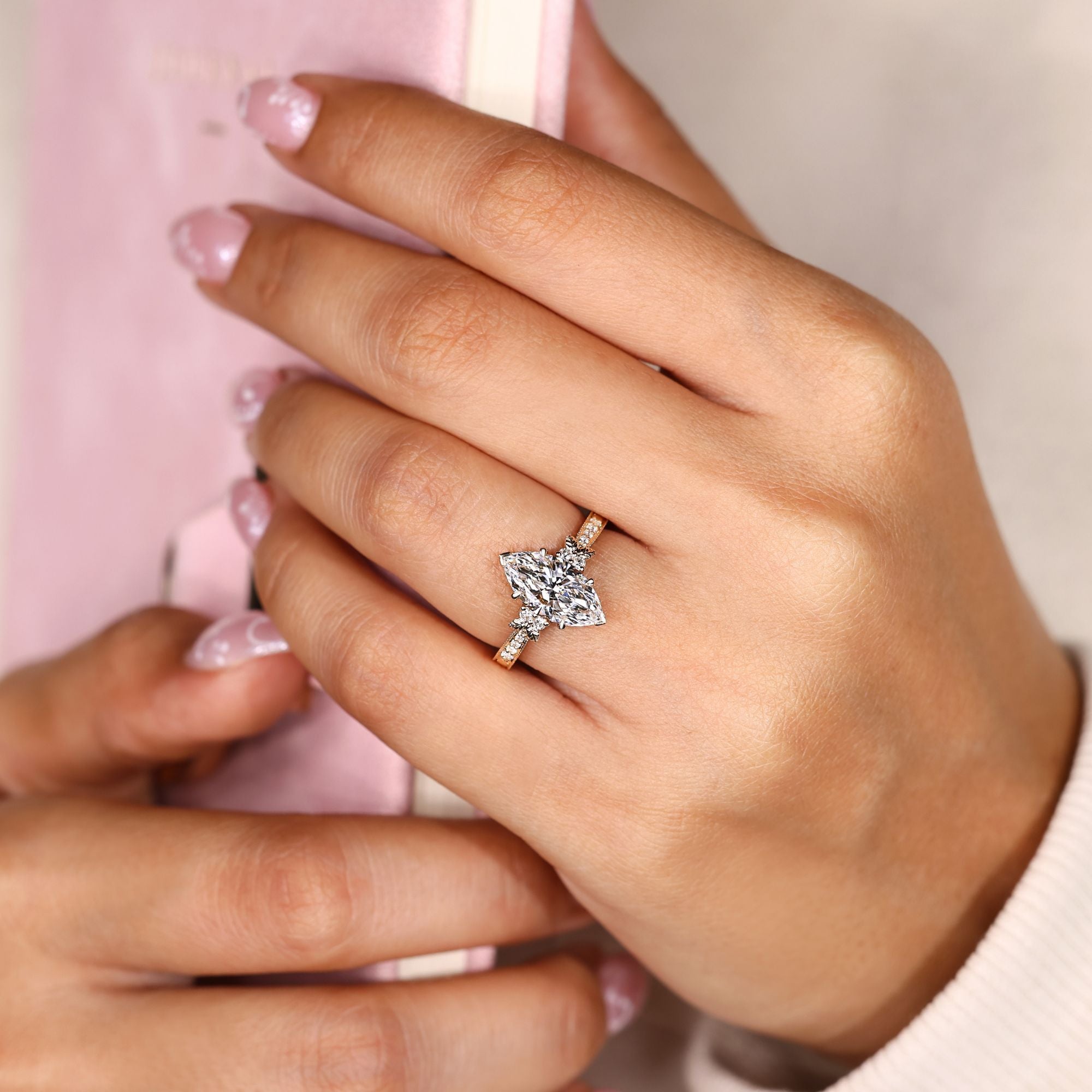 Art Nouveau marquise ring with pave side stones.
