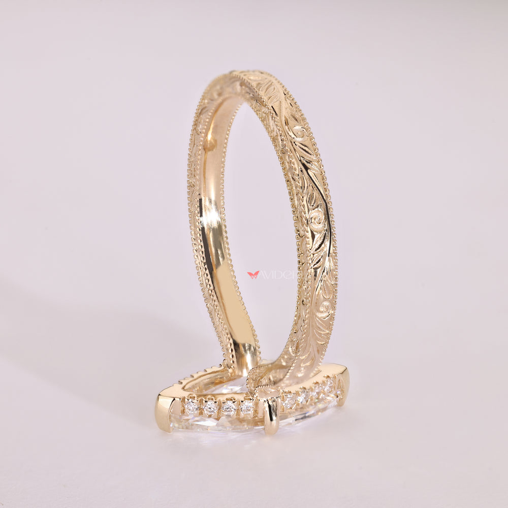 Hidden halo marquise ring with filigree detailing.
