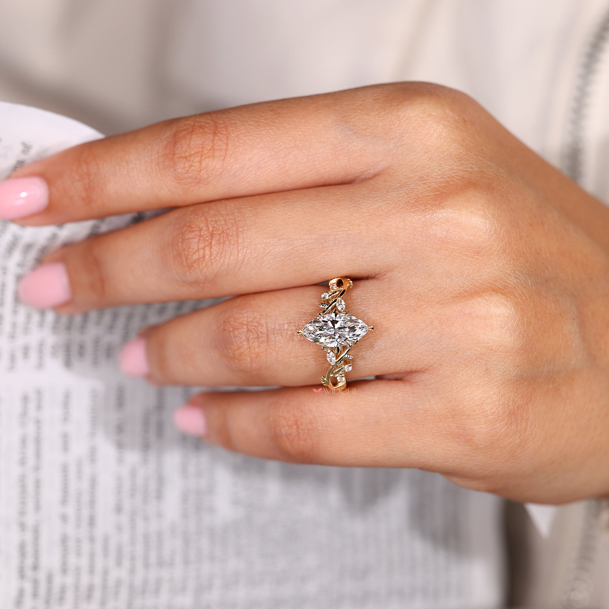 Marquise cut ring with marquise and round side stones.
