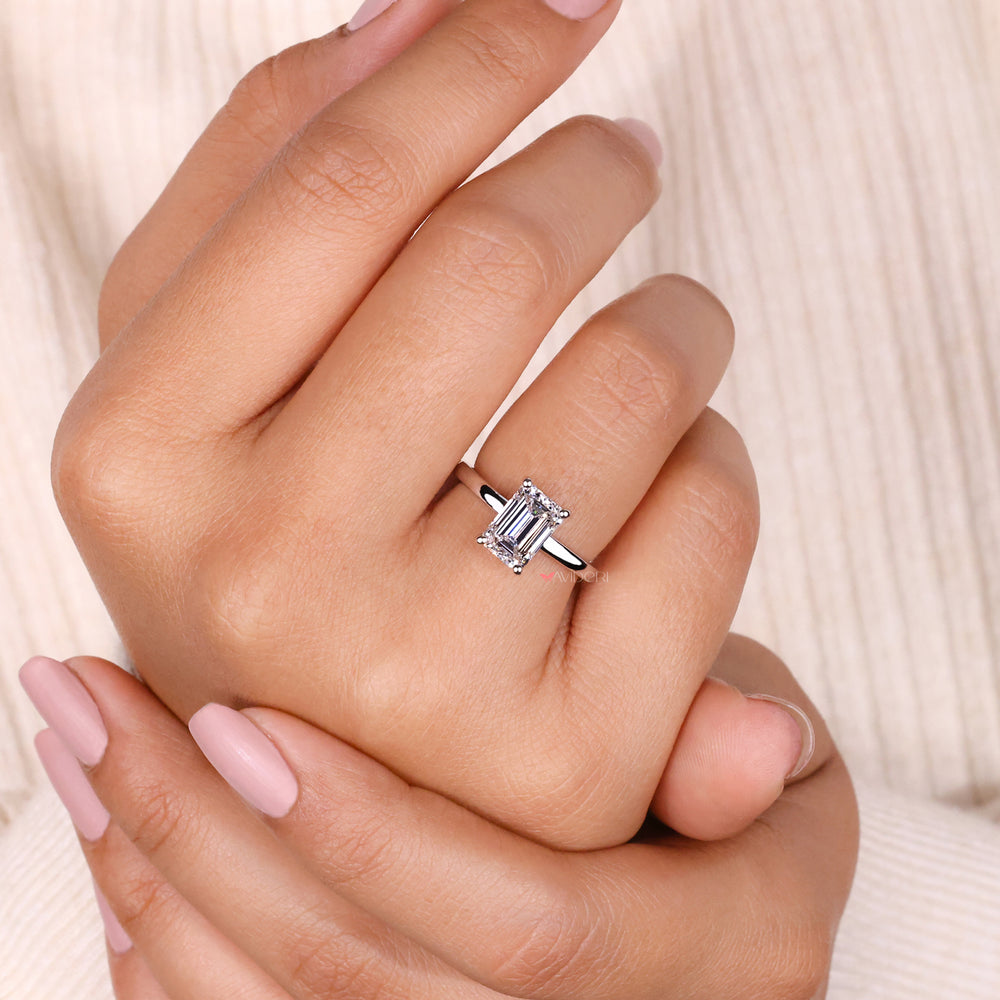 IGI certified emerald cut diamond ring in a classic 4 prong ring setting.
