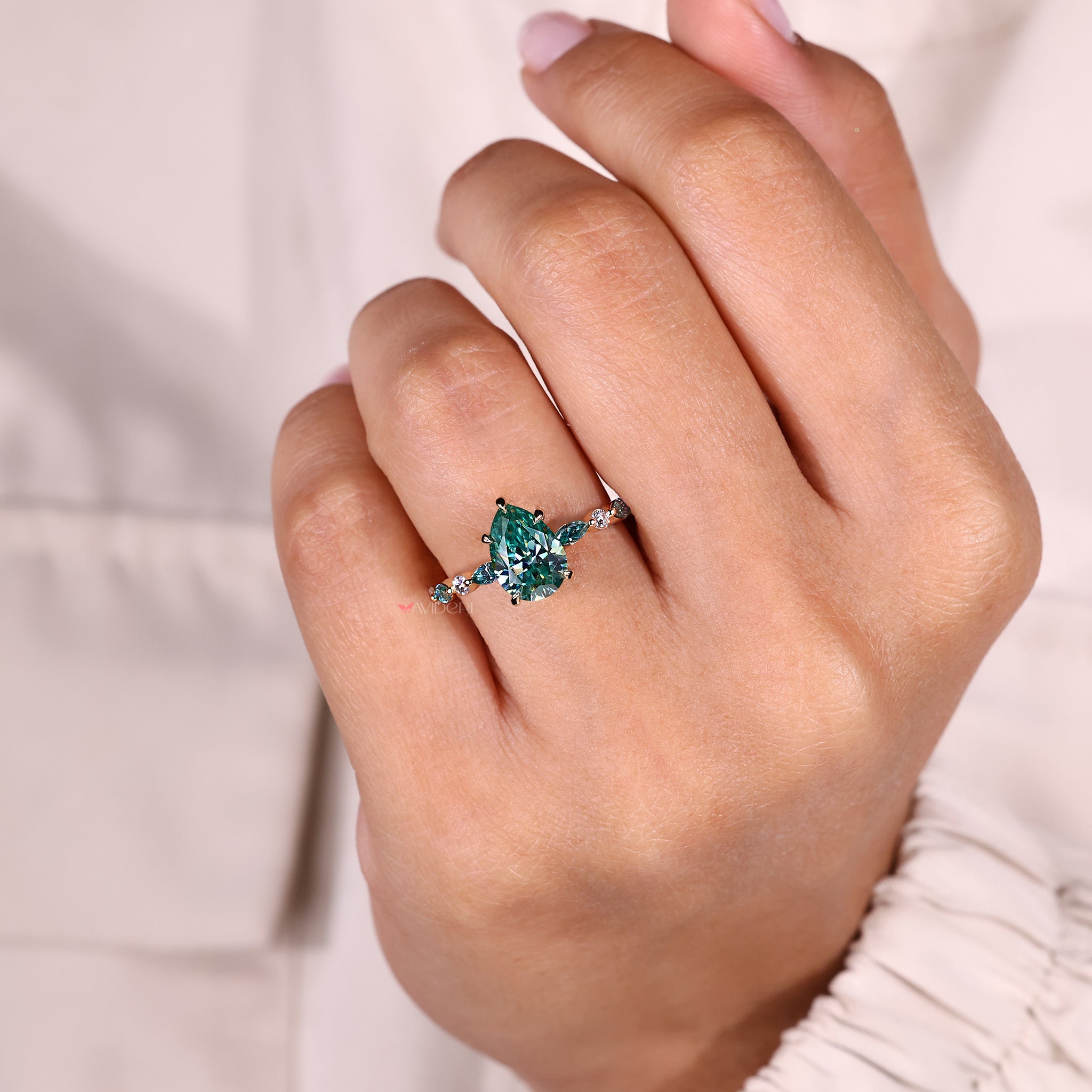 Cyan blue moissanite ring five claw prong.
