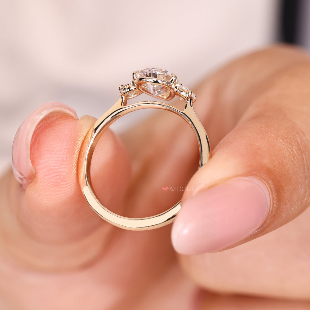 Lab grown pear diamond ring with five claw setting
