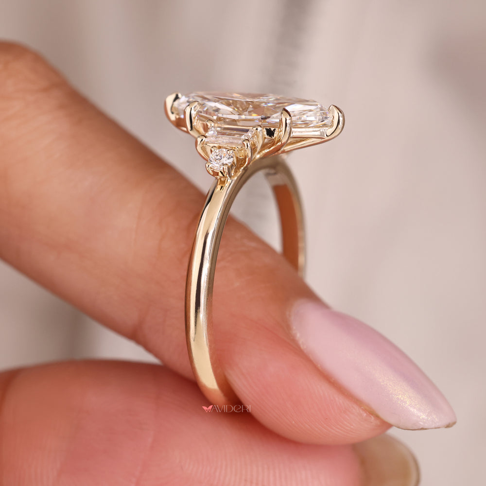 2 round side diamond ring set beside a marquise cut with sleek baguettes.
