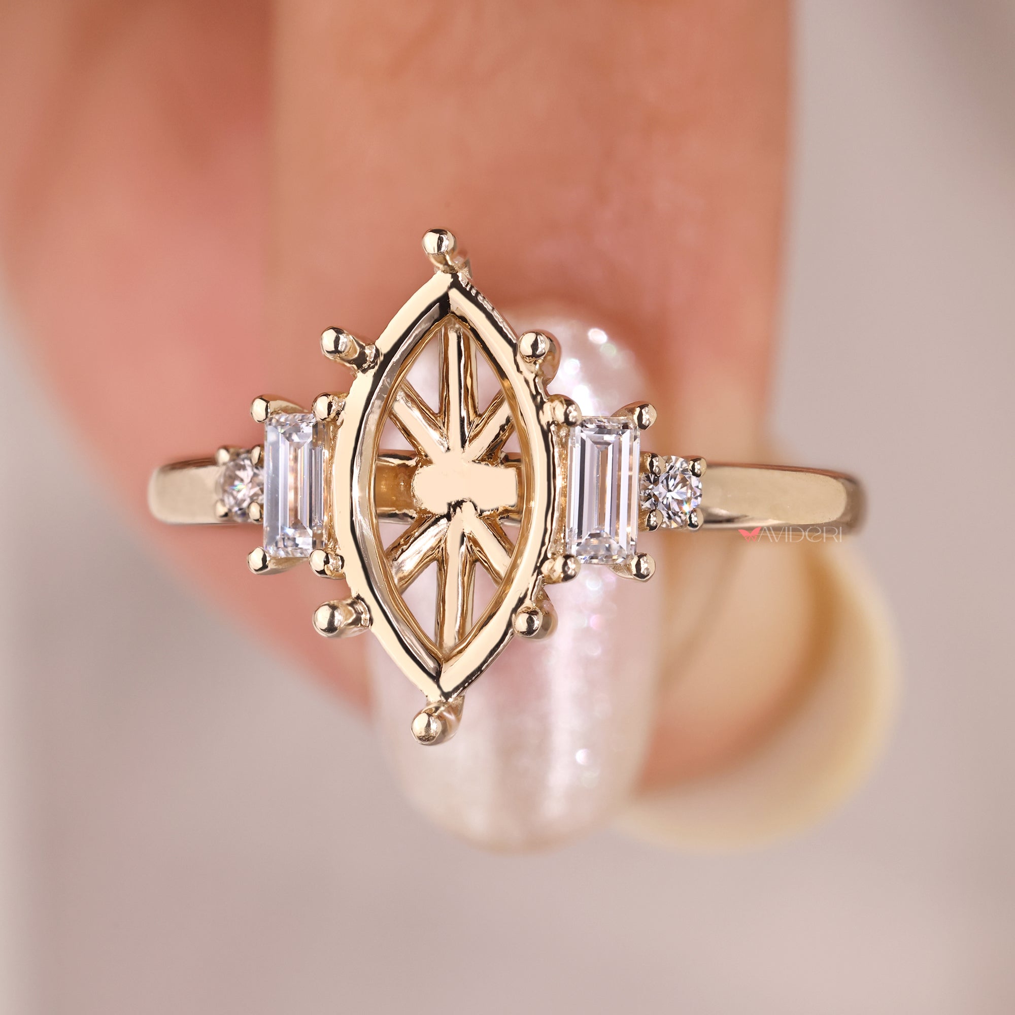 Round side diamond semi mount ring in yellow gold.
