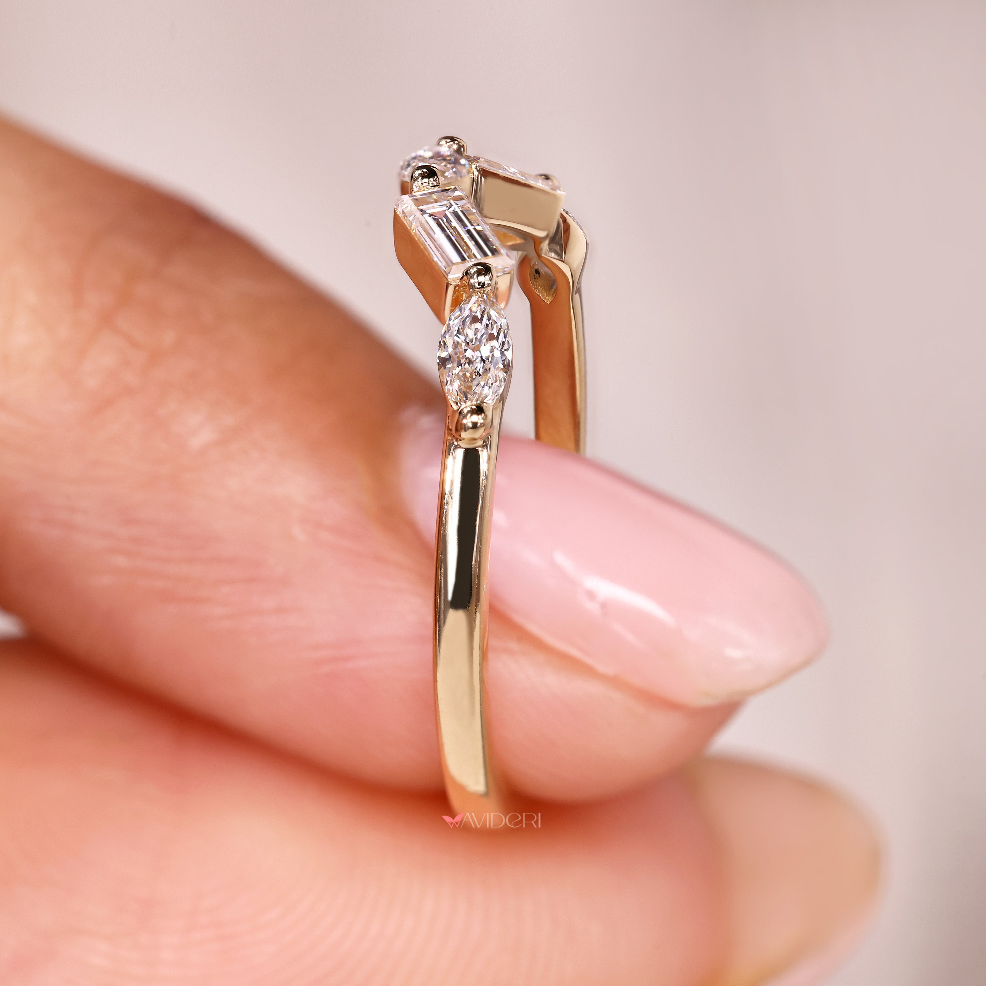 Handmade curved wedding band with five stone diamond style.
