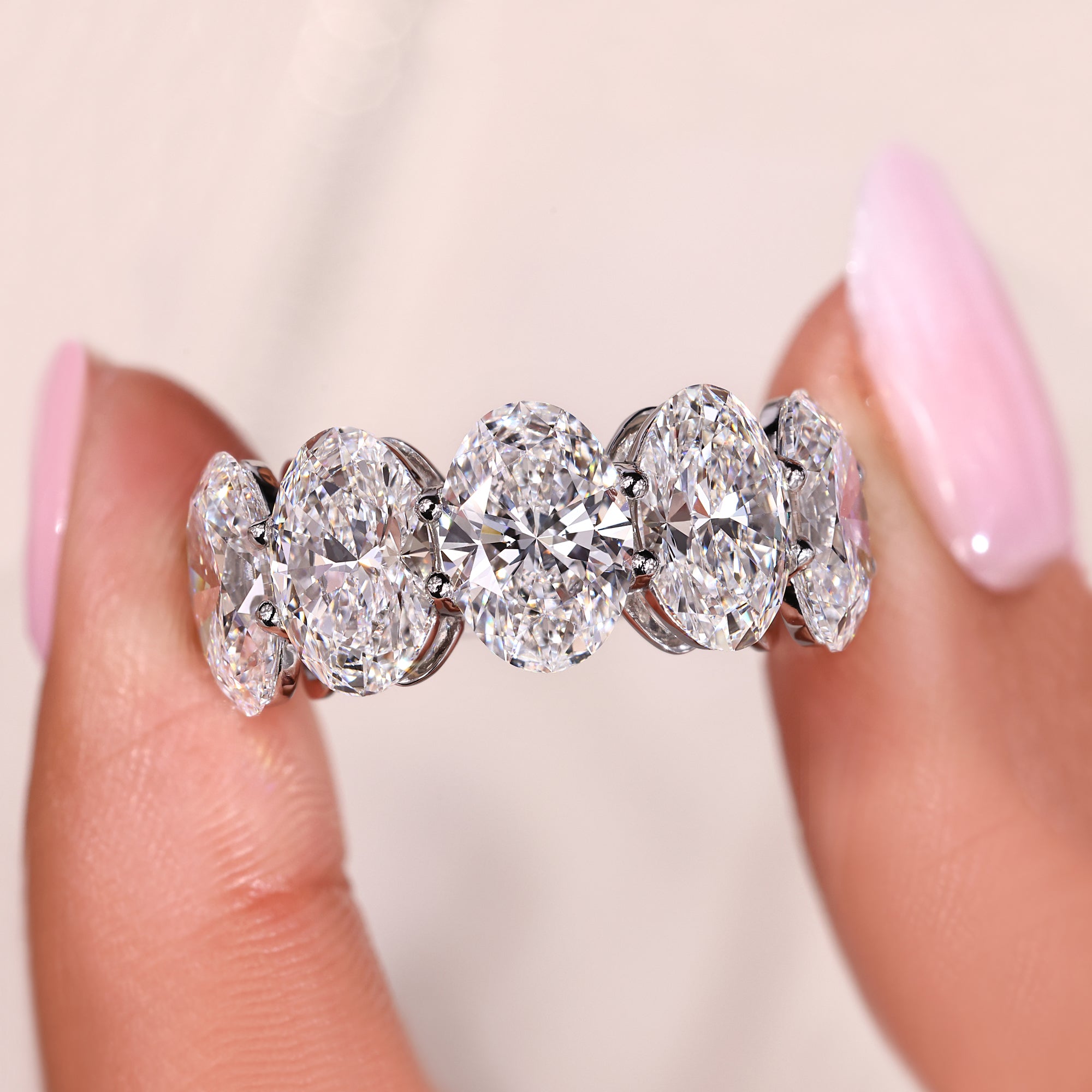 Custom wedding band with oval cut diamonds.