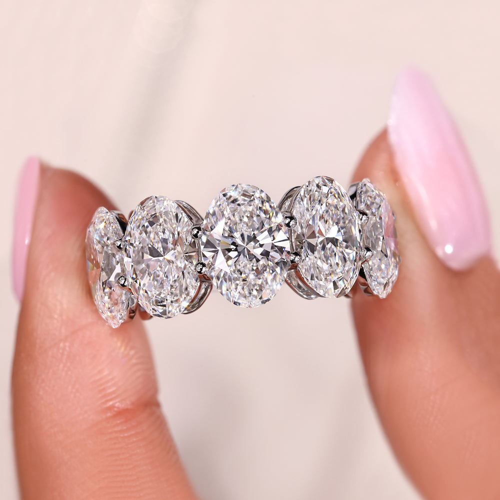 Custom wedding band with oval cut diamonds.