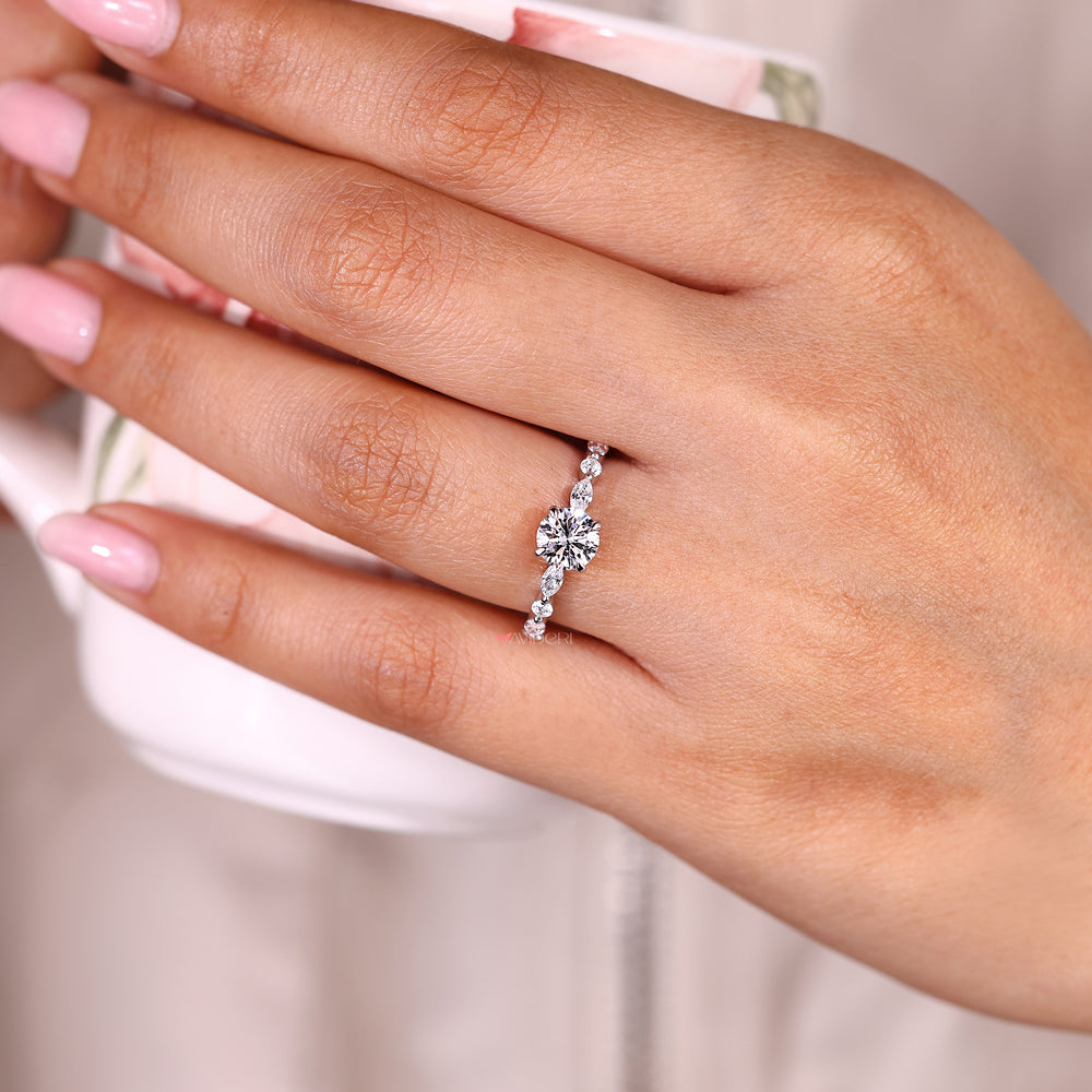 Round diamond ring with floating bubble prong setting.
