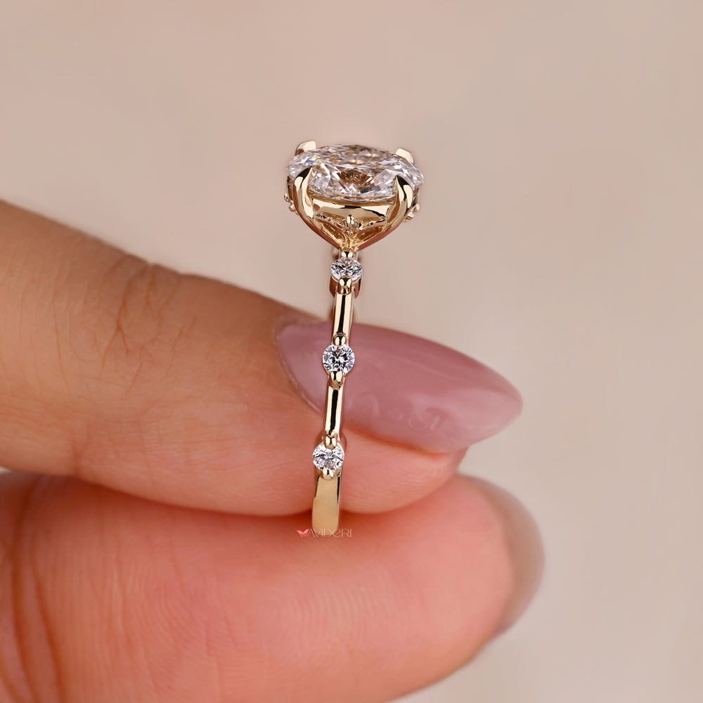 Side stone engagement rings designed with oval engagement rings with side stones, offering a luxurious and versatile style.
