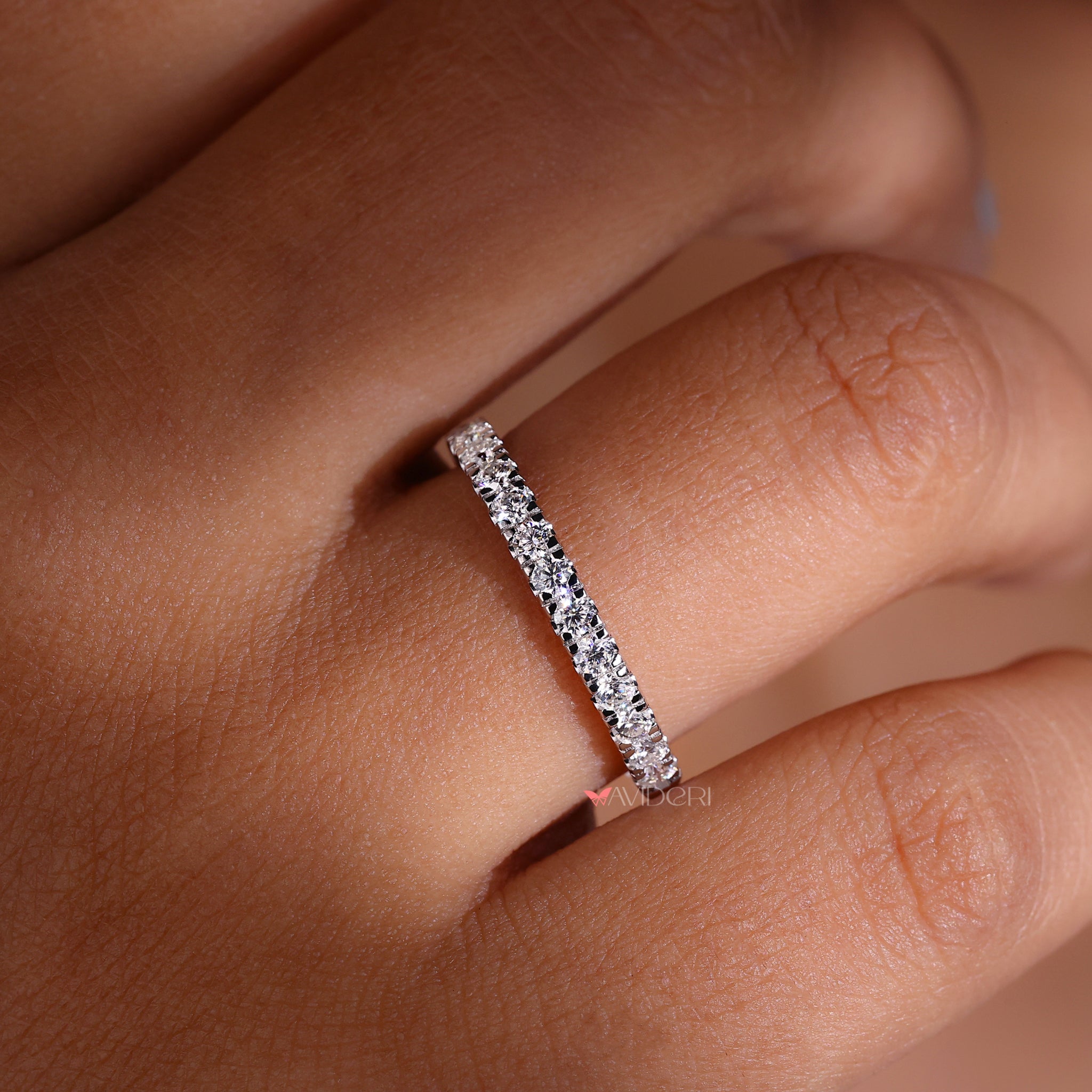 White gold eternity band with a smooth, polished finish.
