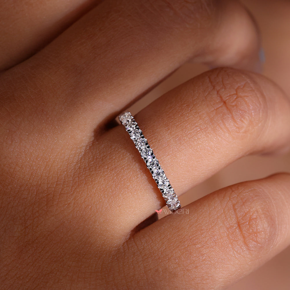 White gold eternity band with a smooth, polished finish.
