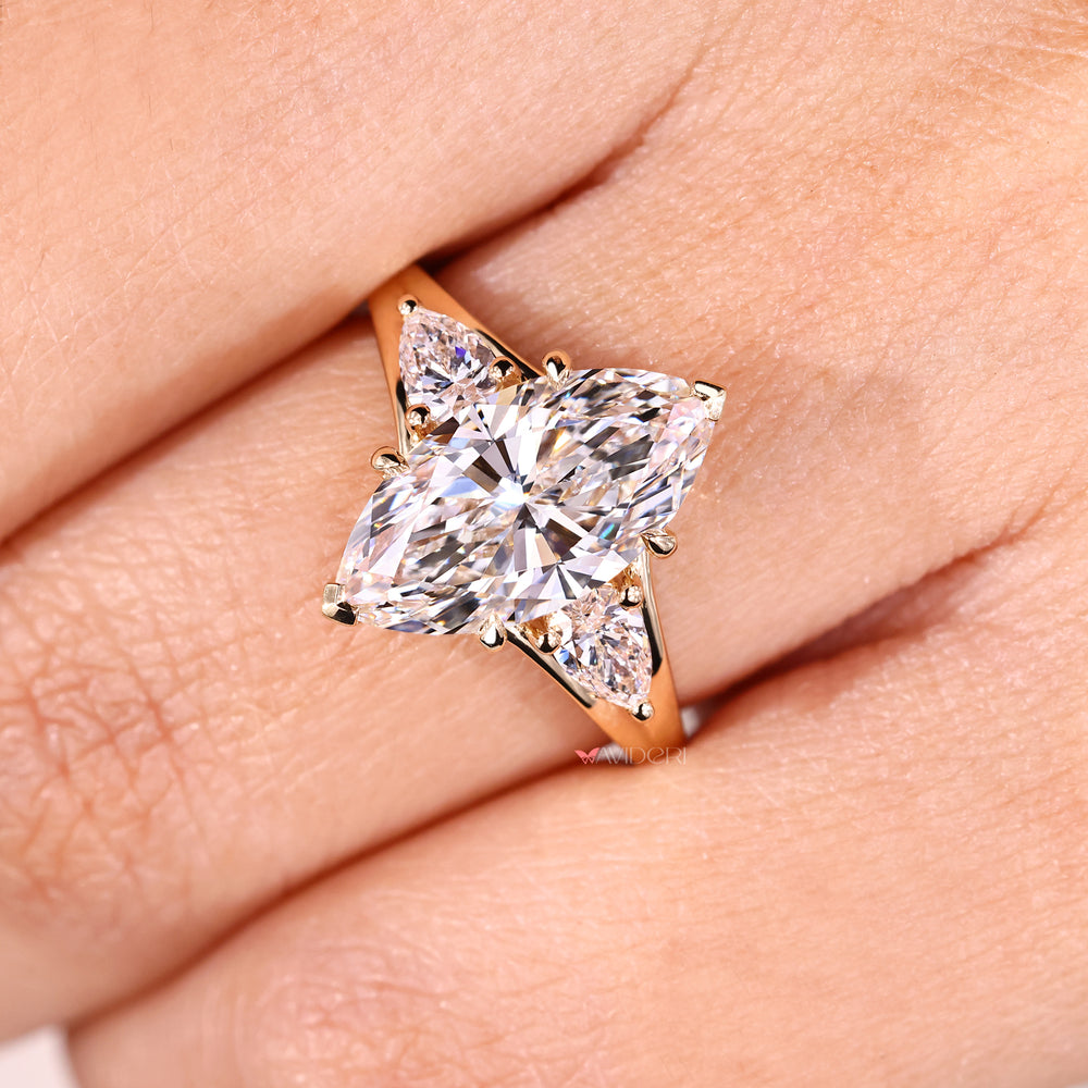 Four claw prong marquise engagement ring.