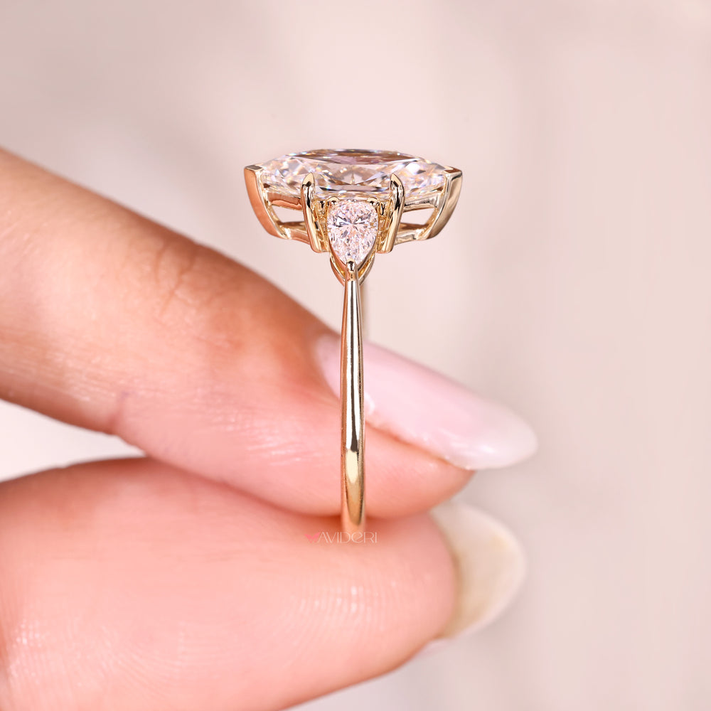 Handmade dutch marquise ring with pear accents.
