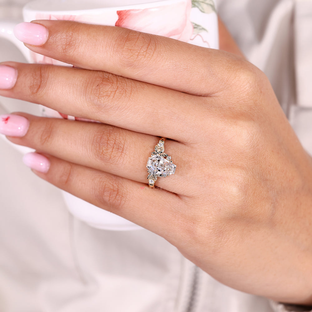 Coffin cut ring with round side stones.