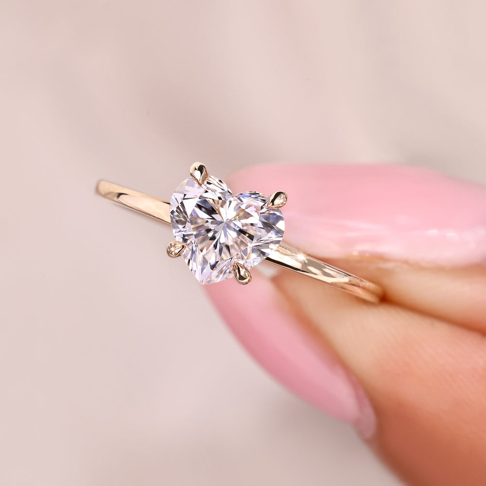 Lab grown heart cut diamond ring with secure prong setting.
