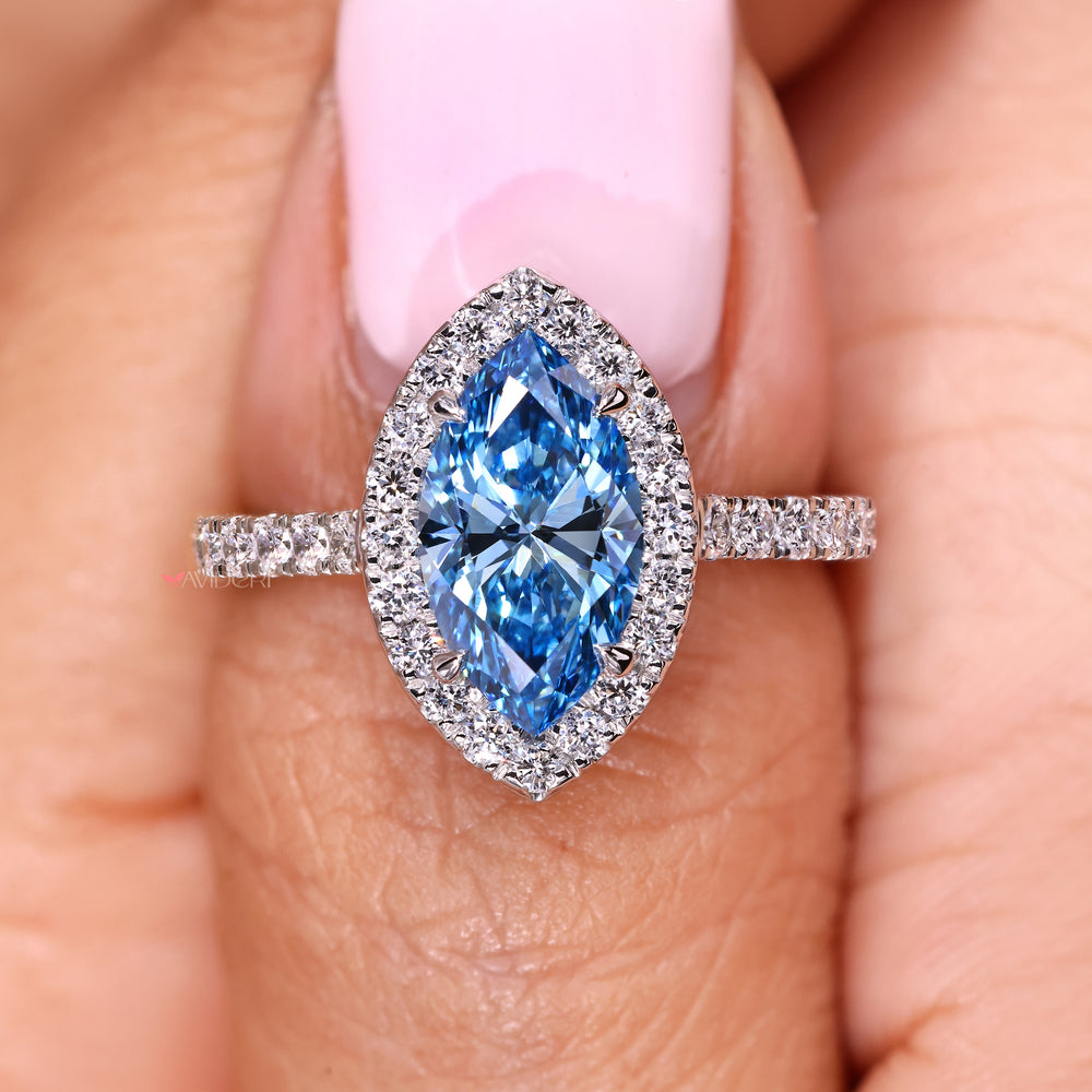 Marquise cut engagement ring with round pave side diamonds
