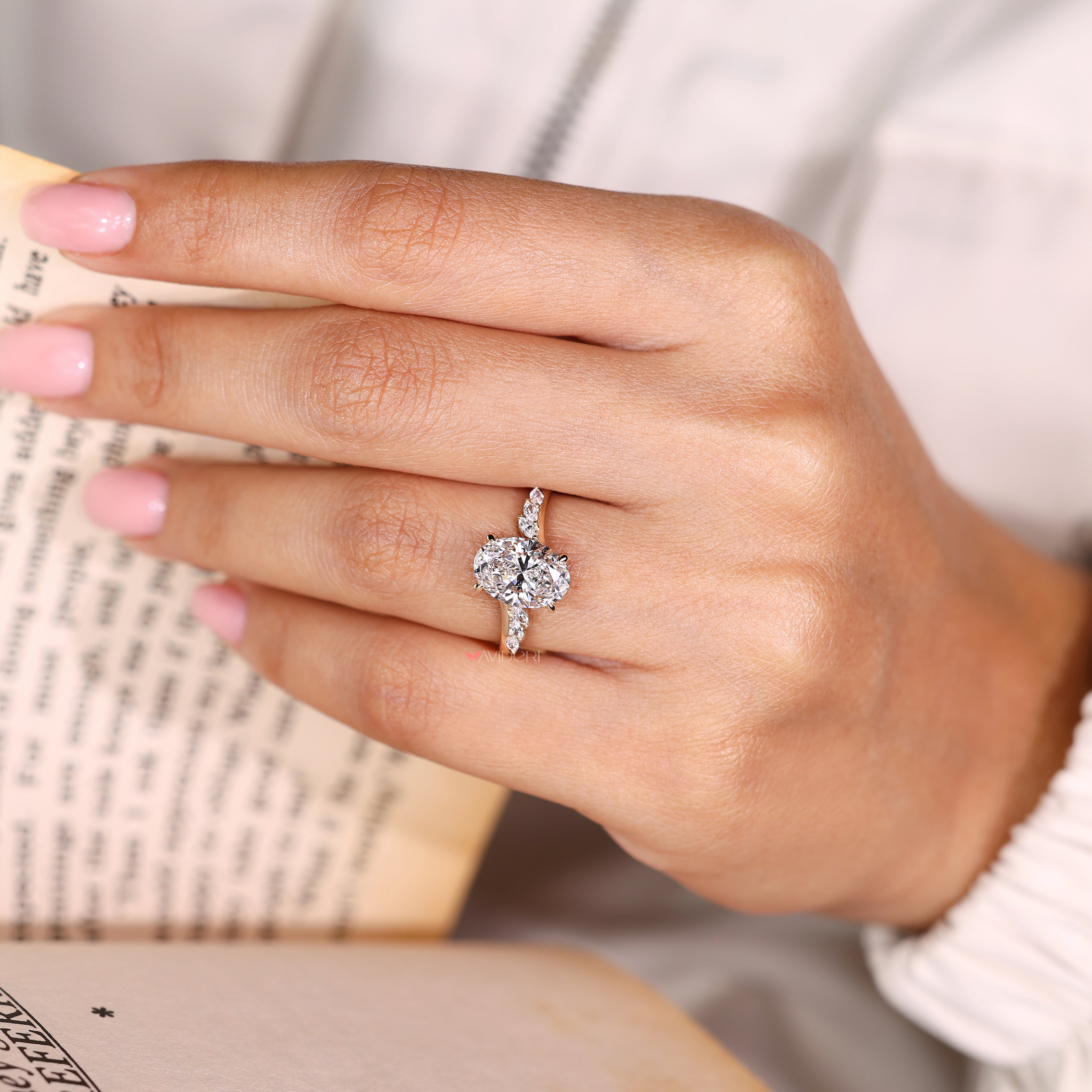 Oval lab grown diamond ring with hidden halo setting
