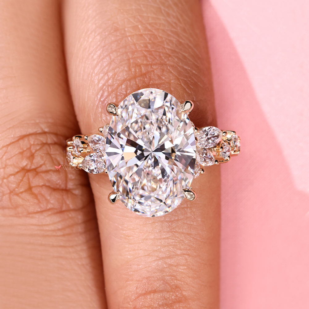 Lab grown oval cut diamond ring with four prongs.
