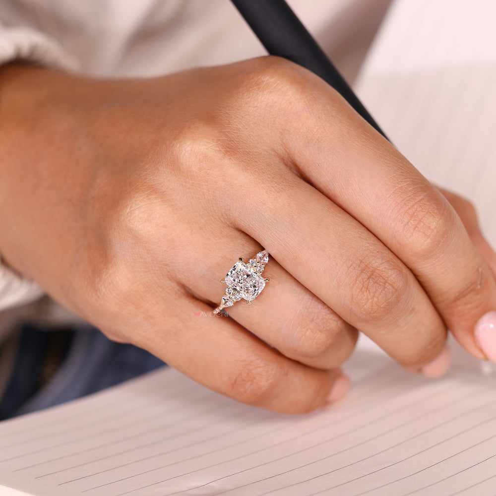 Lab grown cushion diamond ring with muse setting details.
