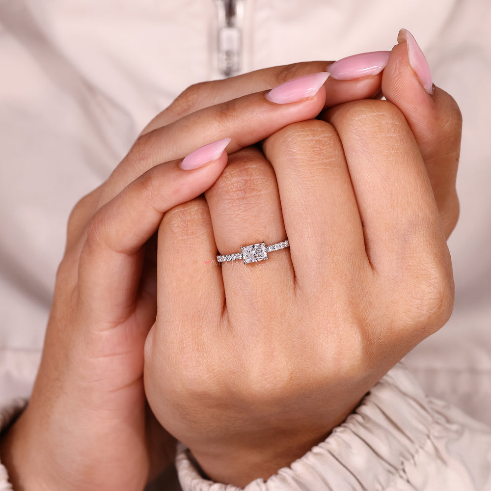 Radiant cut diamond ring with classic four prongs.