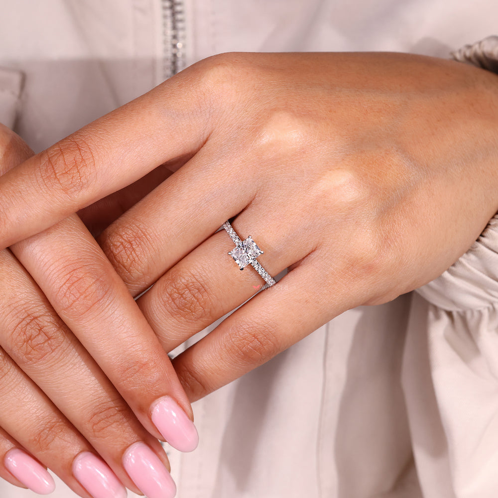 Radiant cut diamond ring with classic pave band design.
