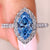 Marquise blue diamond ring with round halo and pave
