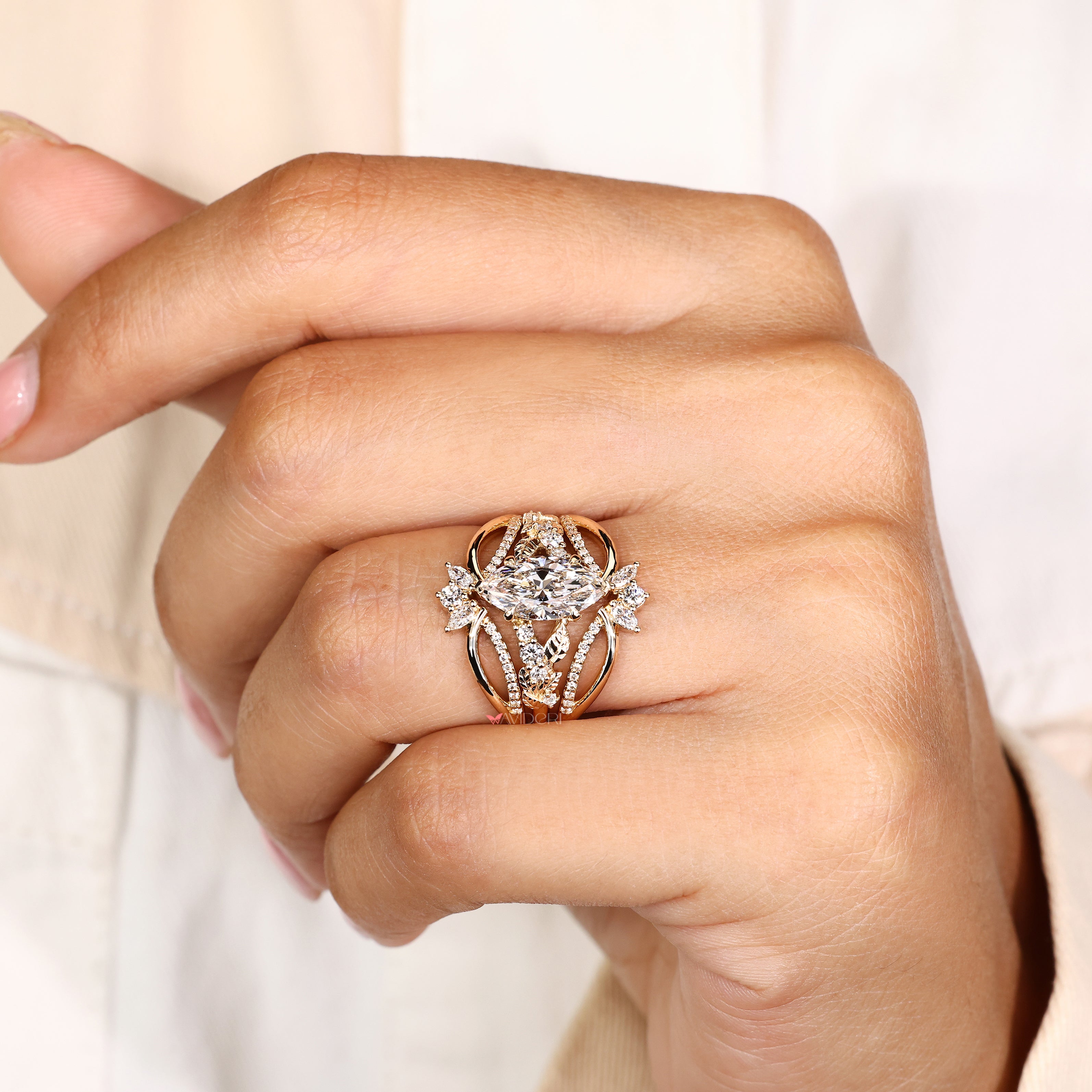 Marquise engagement ring with wrap guard band design
