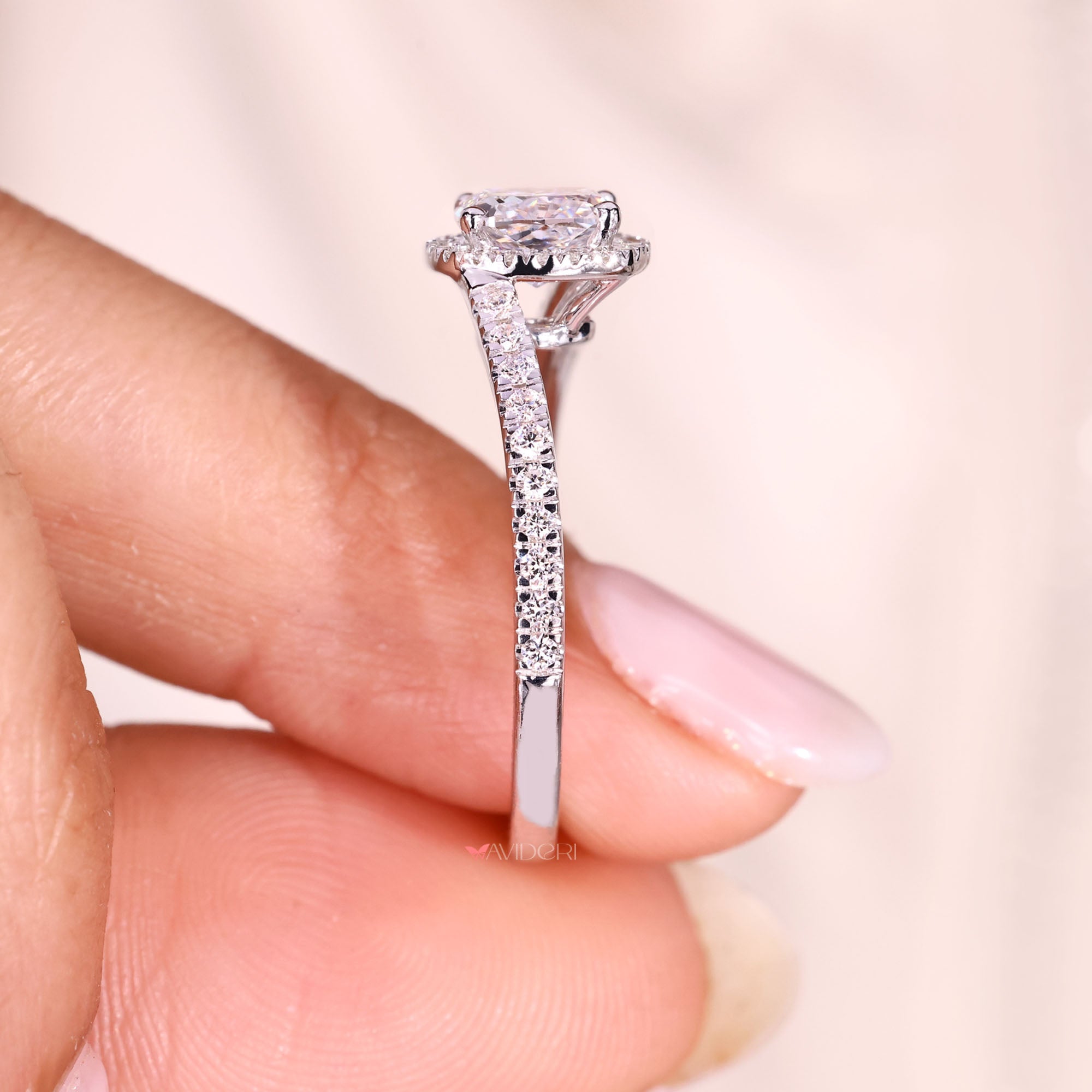 Lab grown cushion cut diamond ring with halo design.
