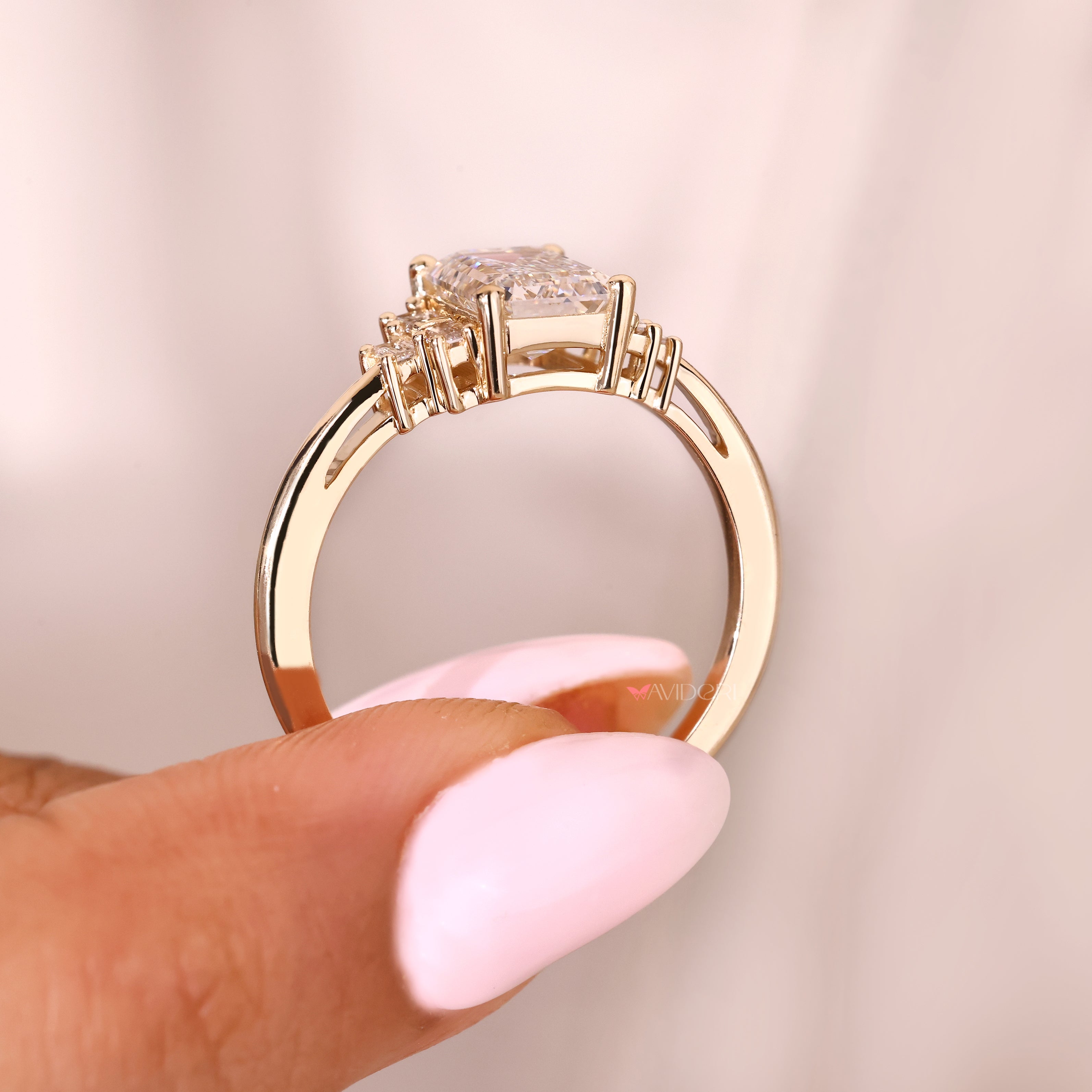 Handmade emerald diamond ring with seven stone arrangement
