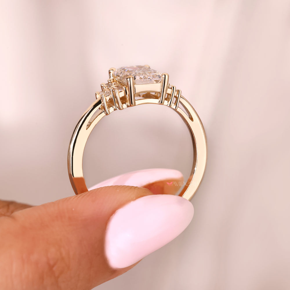 Handmade emerald diamond ring with seven stone arrangement
