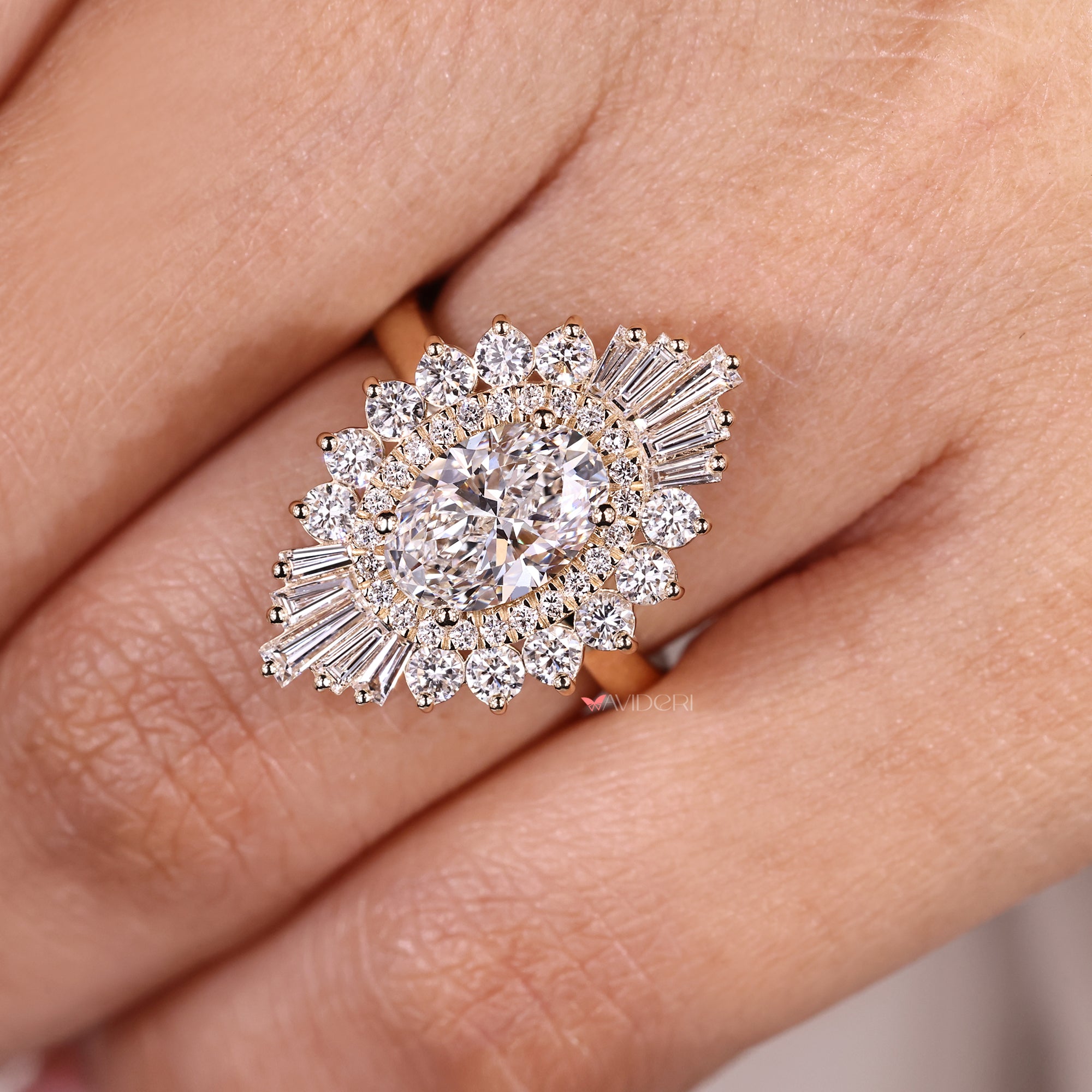 Oval diamond ring with snowflake inspired halo.