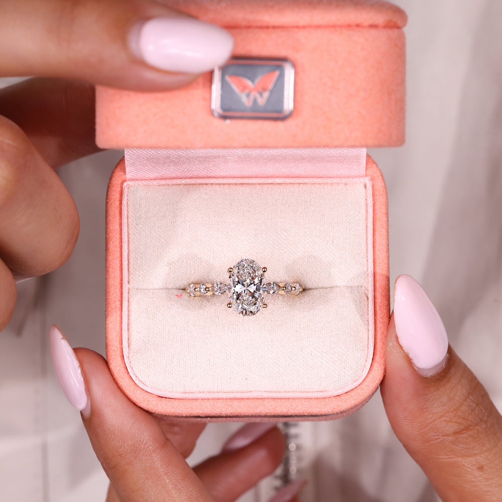 IGI certified oval ring with shared prong pave details
