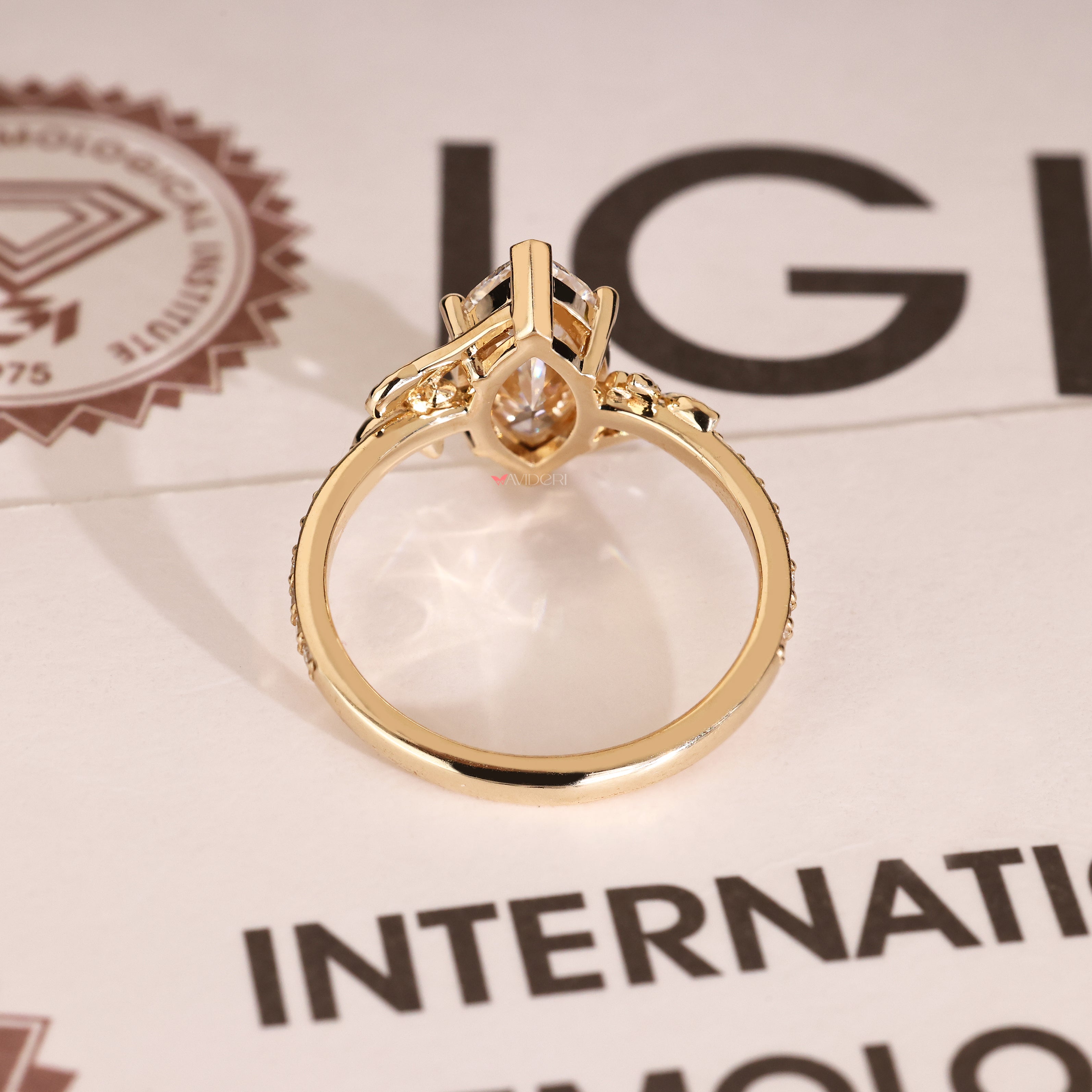 Handmade marquise diamond ring with nature inspired leaf details
