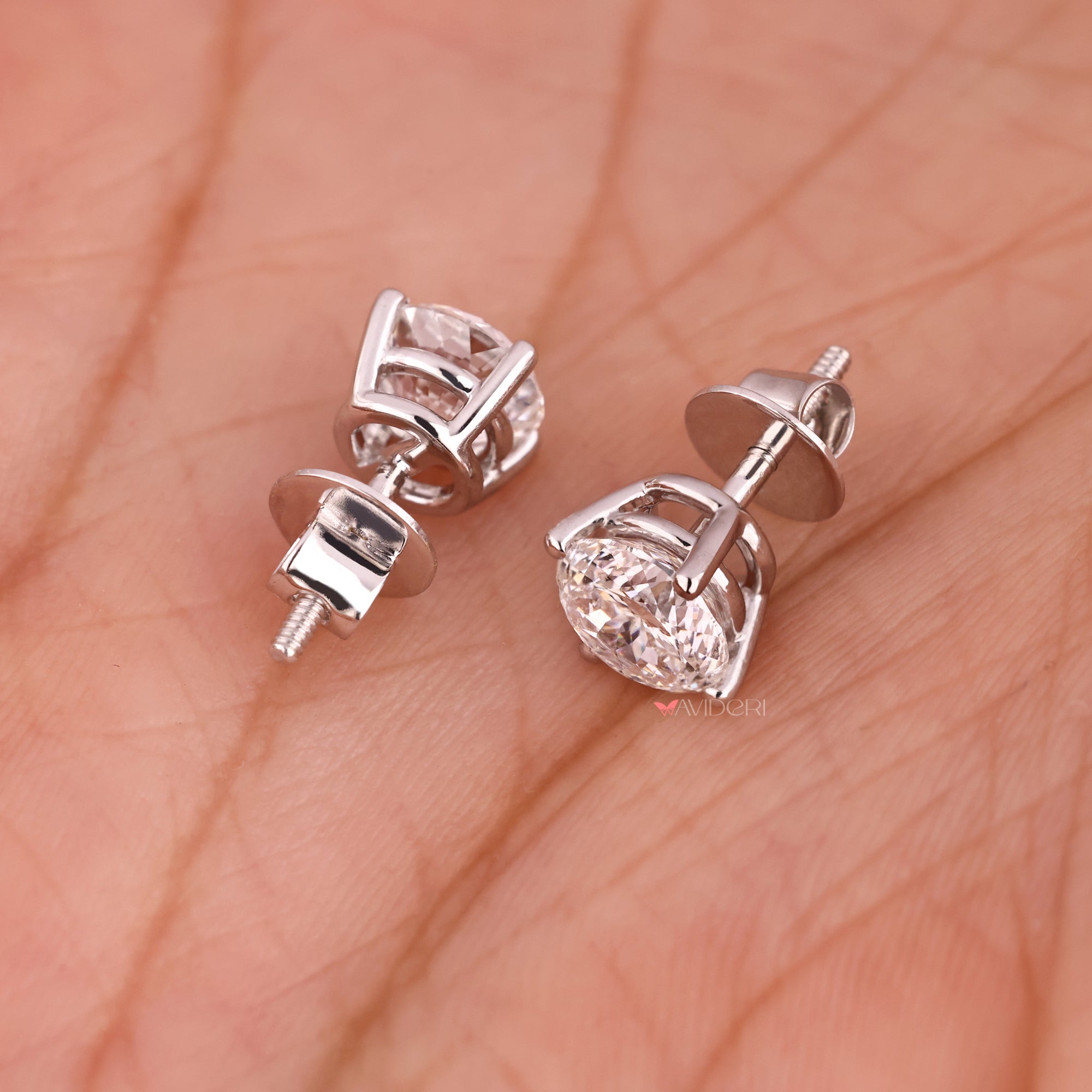 White gold earrings with Portuguese cut diamond studs.