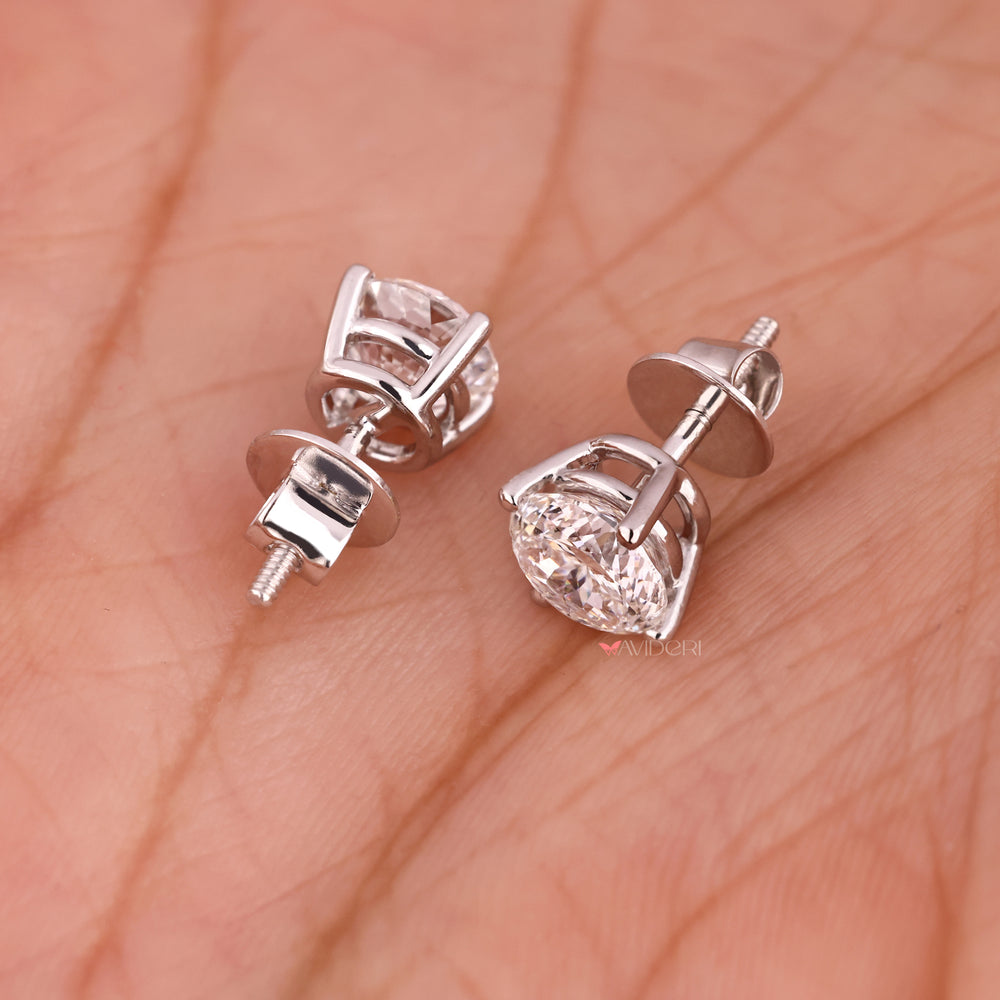 White gold earrings with Portuguese cut diamond studs.