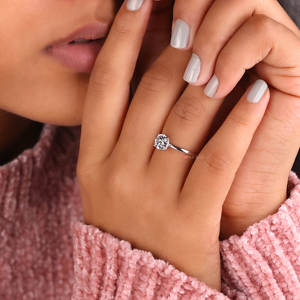 Round brilliant cut diamond in a solitaire engagement ring crafted with care and precision.
