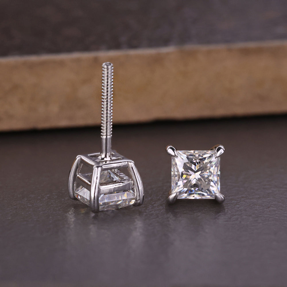 Princess cut stud earrings shine with sharp, clean angles.