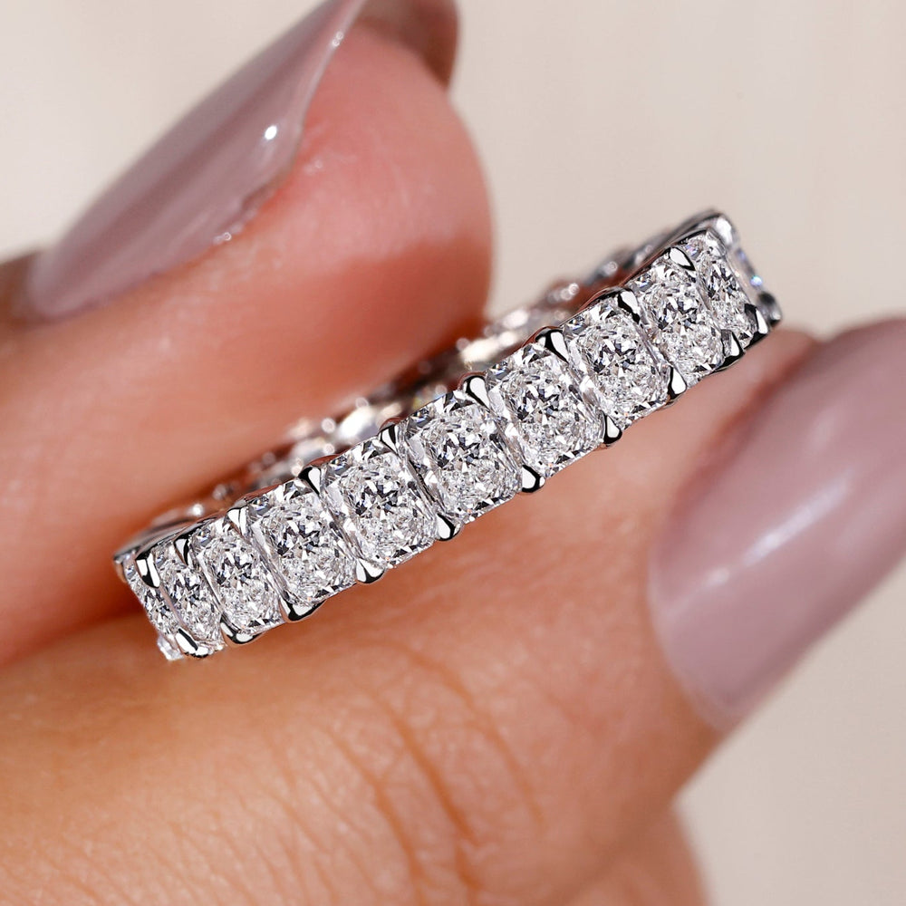 Radiant diamond wedding band with elegant design and sparkling diamonds.
