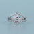 Round Cut Solitaire Ring with Guard Wrap Band and gold design.
