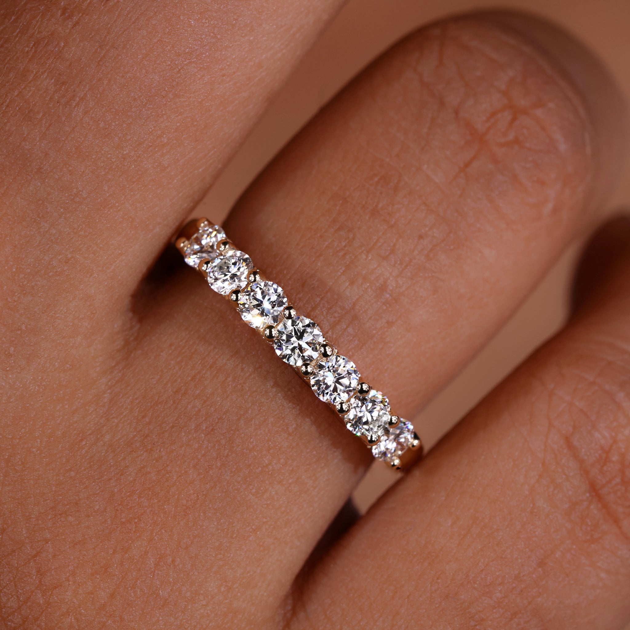 Diamond half eternity band with elegant diamond setting.
