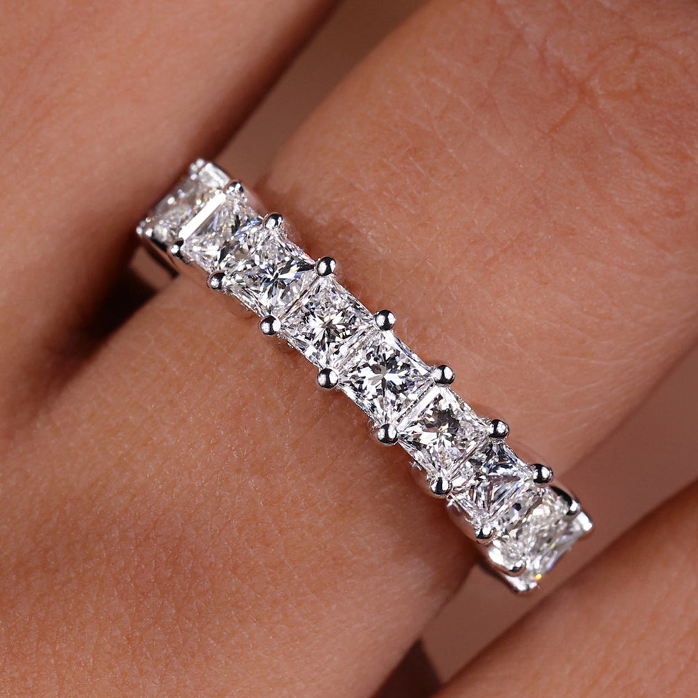 Princess cut diamond band with sleek design.
