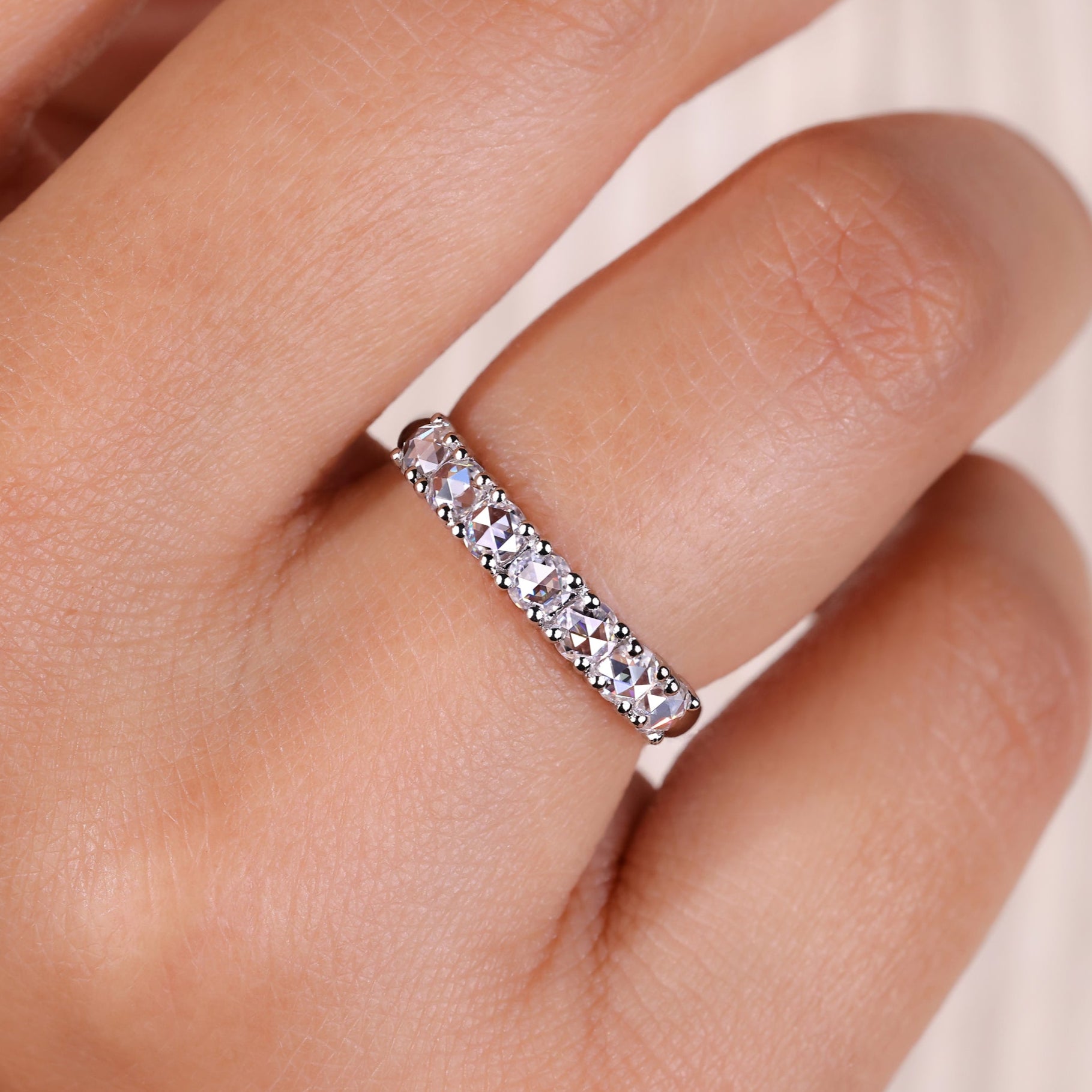 7 stone wedding band with sparkling diamonds for a timeless look.
