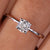 Cushion cut diamond ring with claw prong setting and handmade jewelry design.