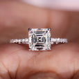 Asscher cut engagement ring with a pave setting and prong set diamonds for a timeless and elegant design.