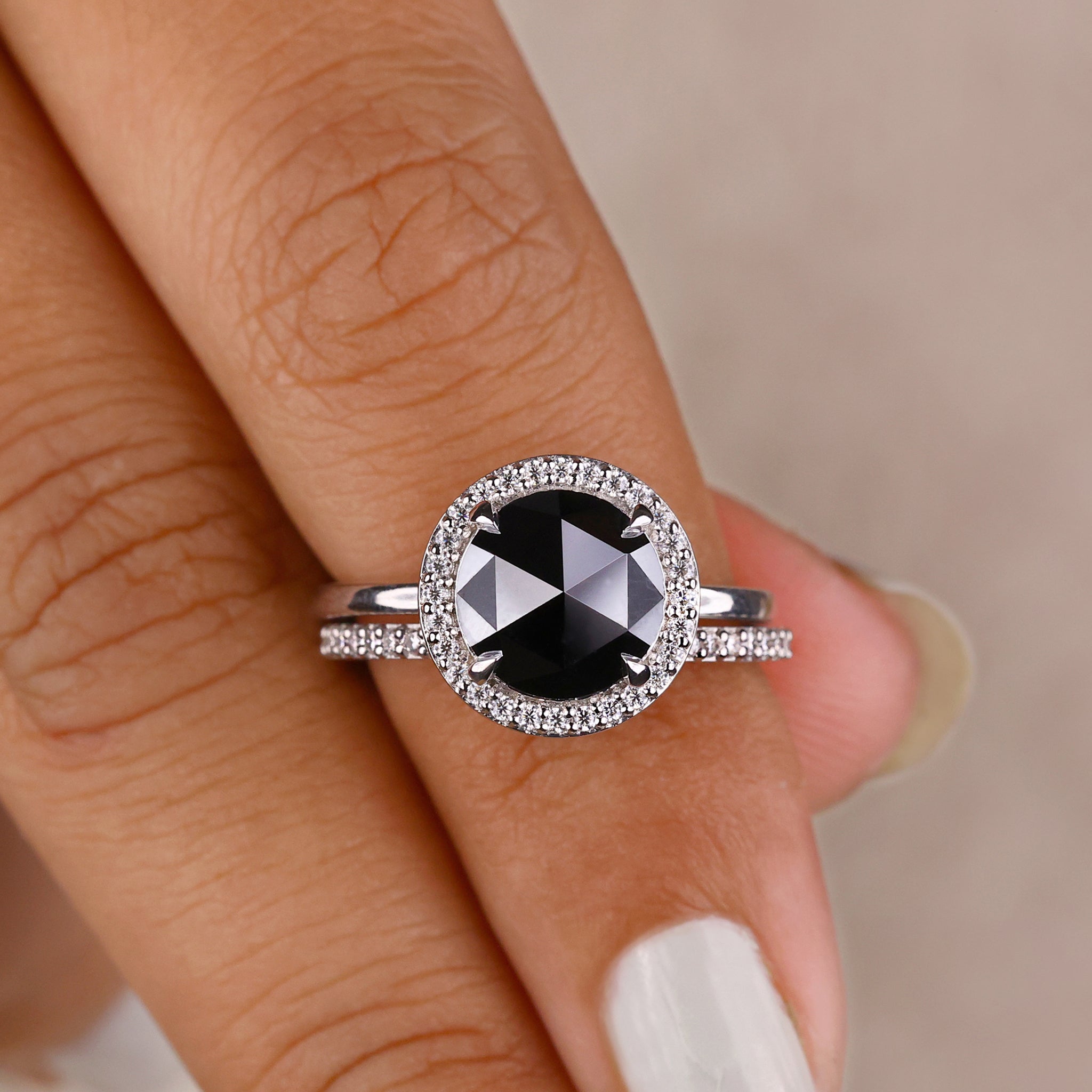 Round rose cut moissanite engagement ring with round cut design.